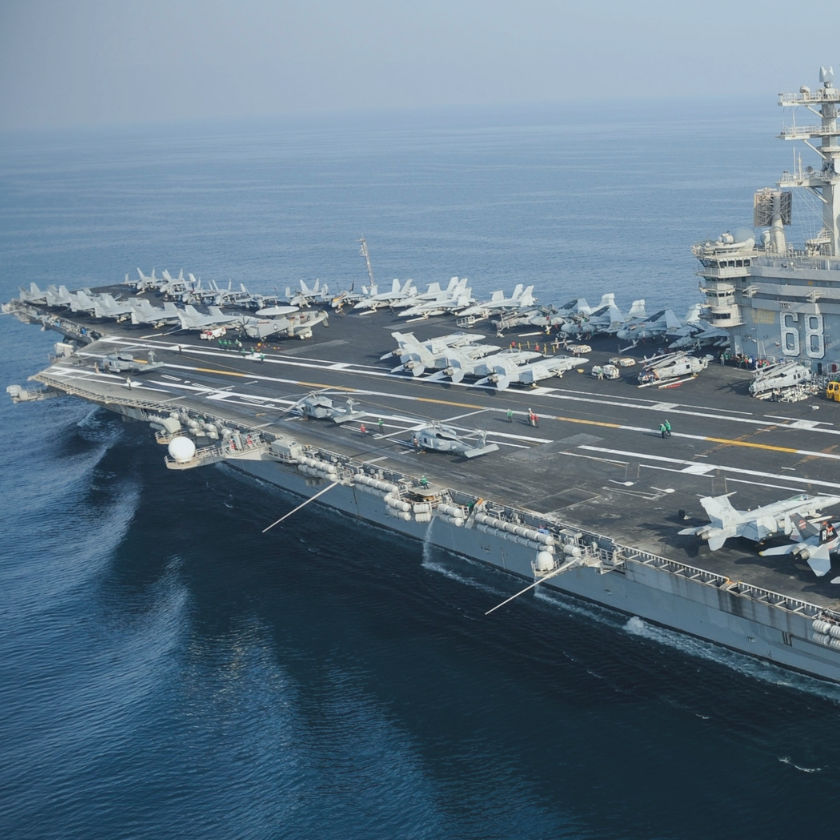 Aircraft carriers sailing at sea (with fighter jets and helicopters, conducting exercises)