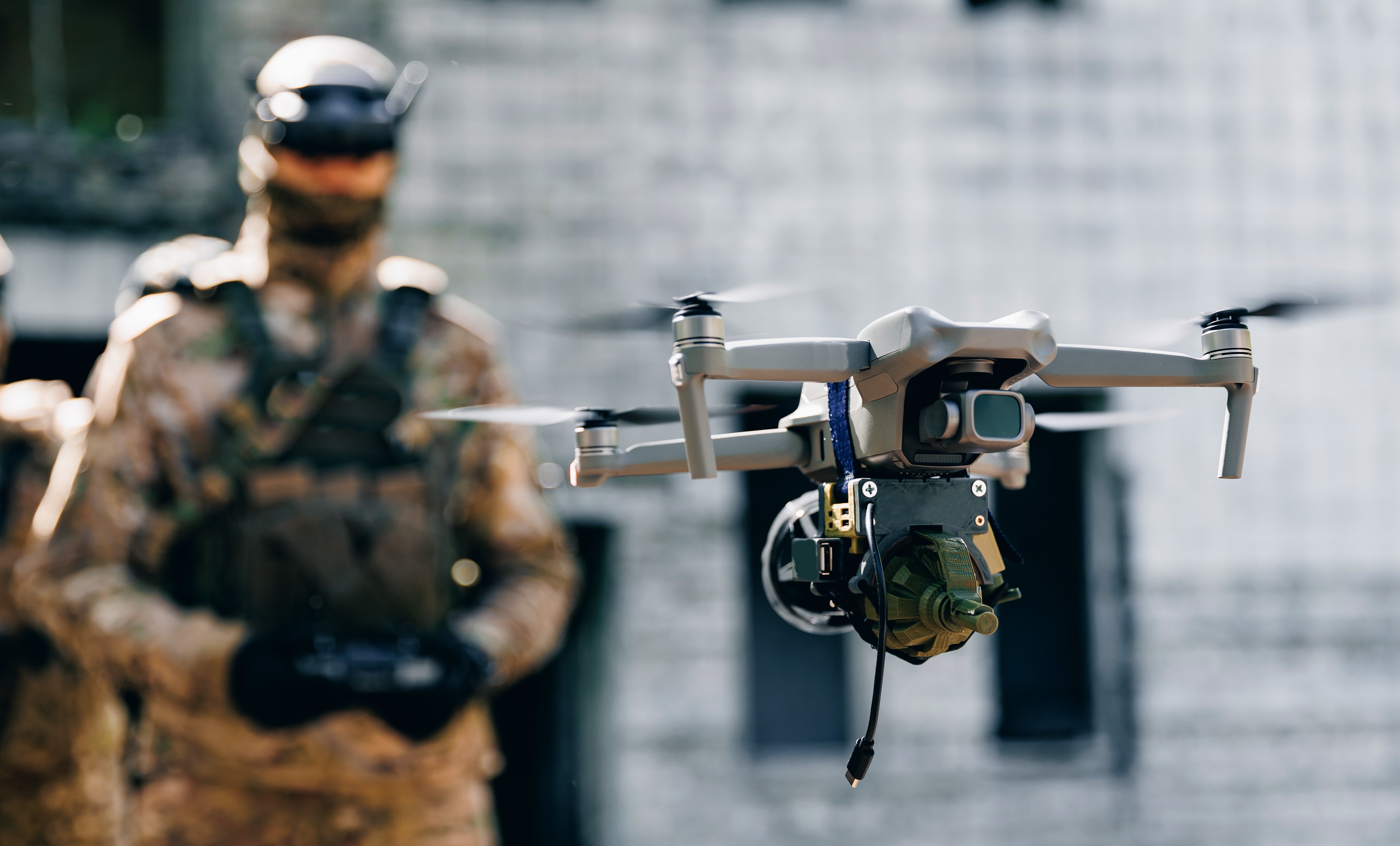 Drone in flight directed by a soldier