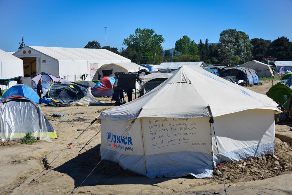 Idomeni/Greece. Inscription on the UNHCR tent in transit refugee/migrant camp