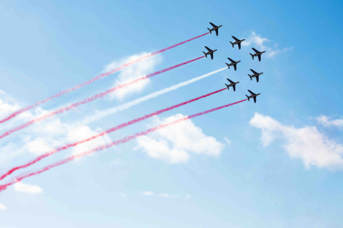 Squadron of planes fly with color trail lines of Austria Sergey