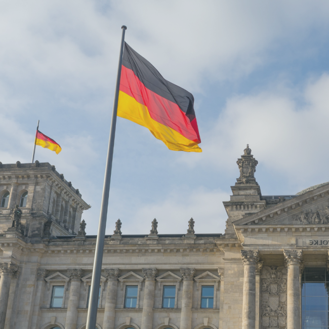 Facade of the German Parliament with the German flag