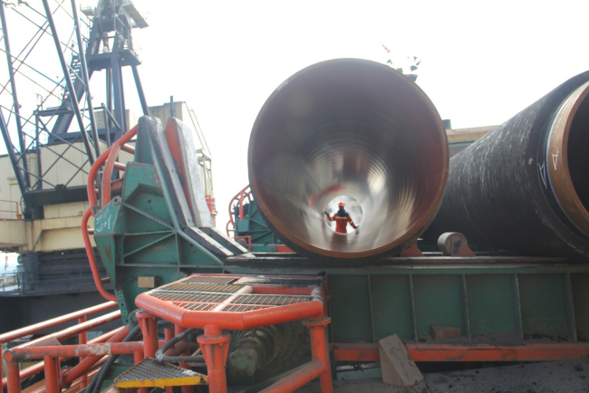 A worker appears in a section of the Nord Stream subsea gas pipeline