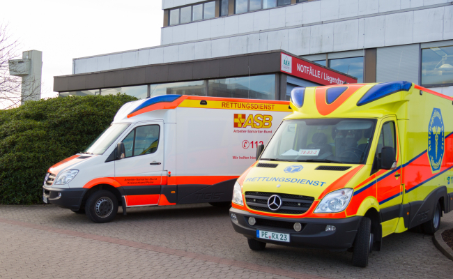 PEINE / GERMANY - MARCH 20, 2017: two german ambulance vehicles stands on hospital at Peine / Germany