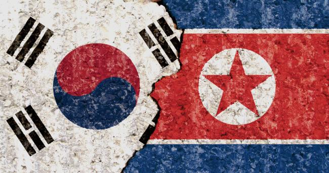 Flags of North Korea and South Korea Credits: Tomas Stehlik for Shutterstock