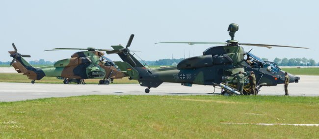 BERLIN, GERMANY - MAY 22, 2014: Preparations for the joint demonstration flights pair of attacking helicopters Eurocopter Tiger. German Army and French Army. Exhibition ILA Berlin Air Show 2014